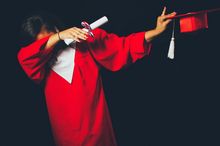 Person wearing red graduation dress